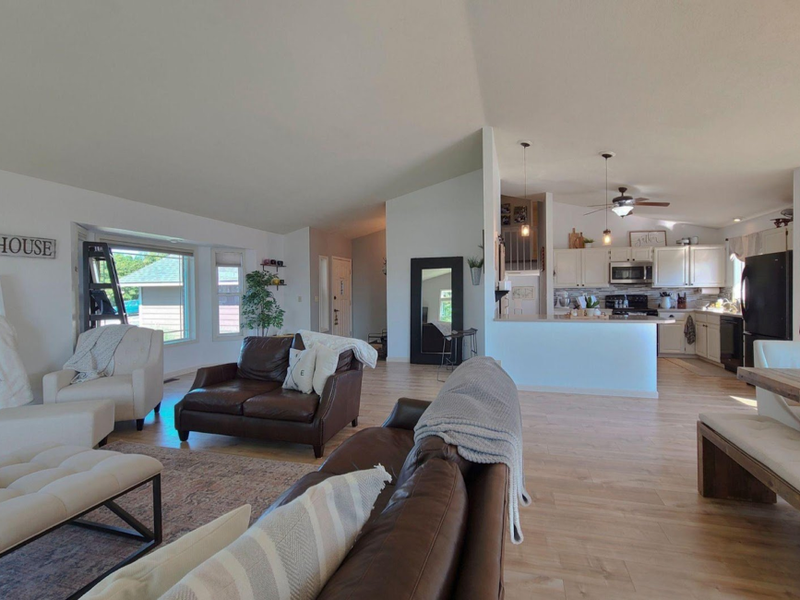 Open concept living room with luxury vinyl flooring
